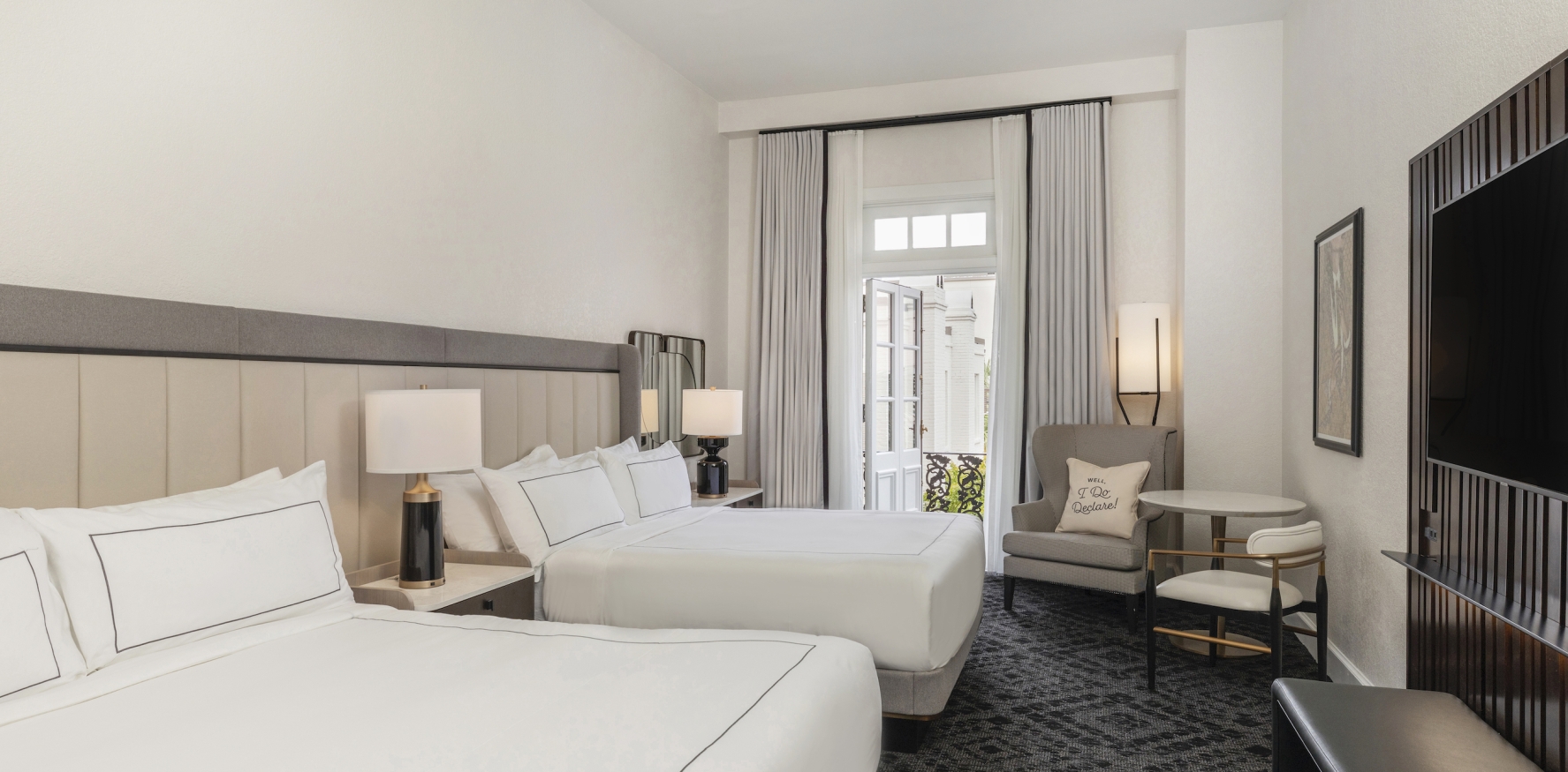 Room with Two Beds and a Balcony View