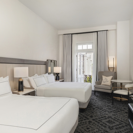 Room with Two Beds and a Balcony View