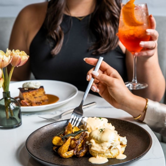 Brunch dishes on a plate with two people
