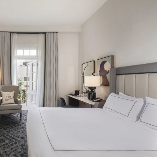 Room with Open Door Leading to Balcony