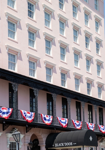 American flag buntings on pink hotel